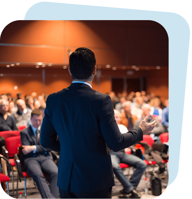 Speaker addressing audience at conference event.