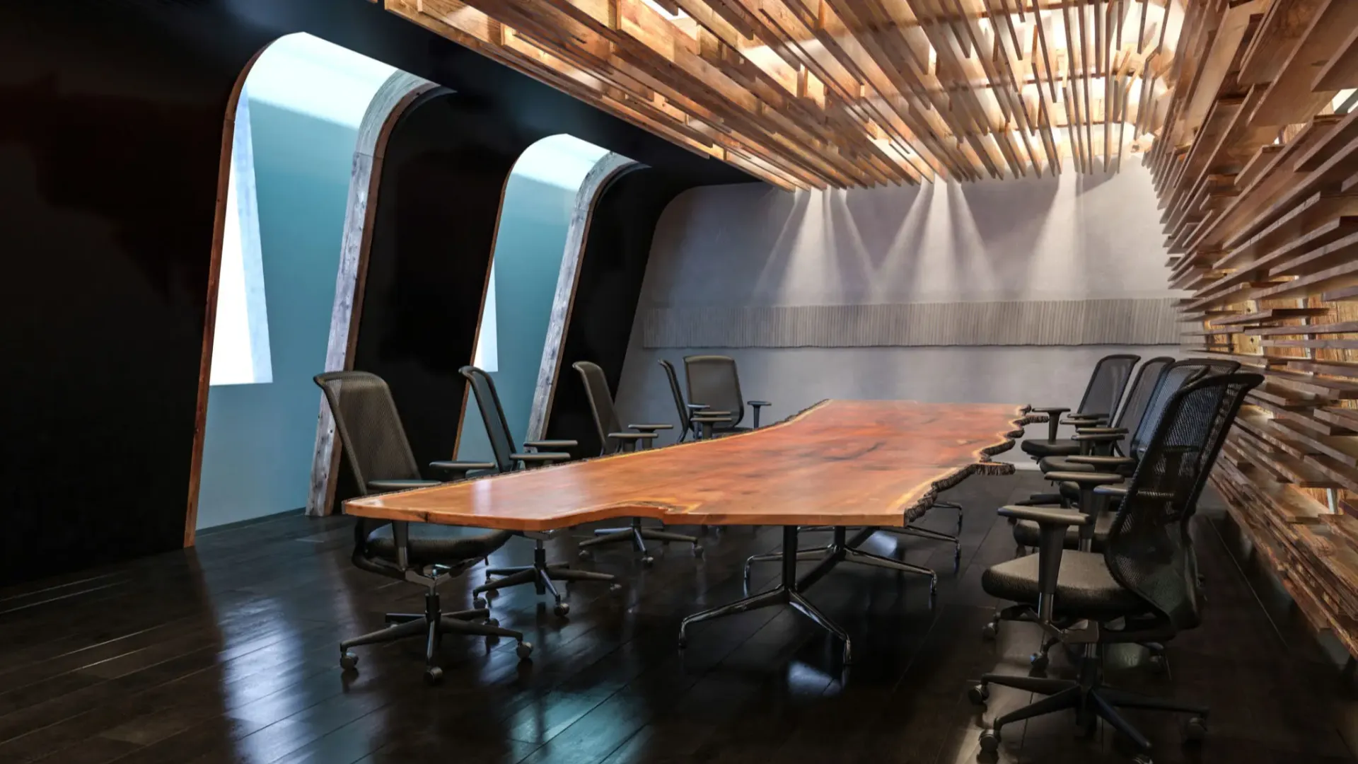 Modern conference room with a large wooden table and ergonomic chairs.