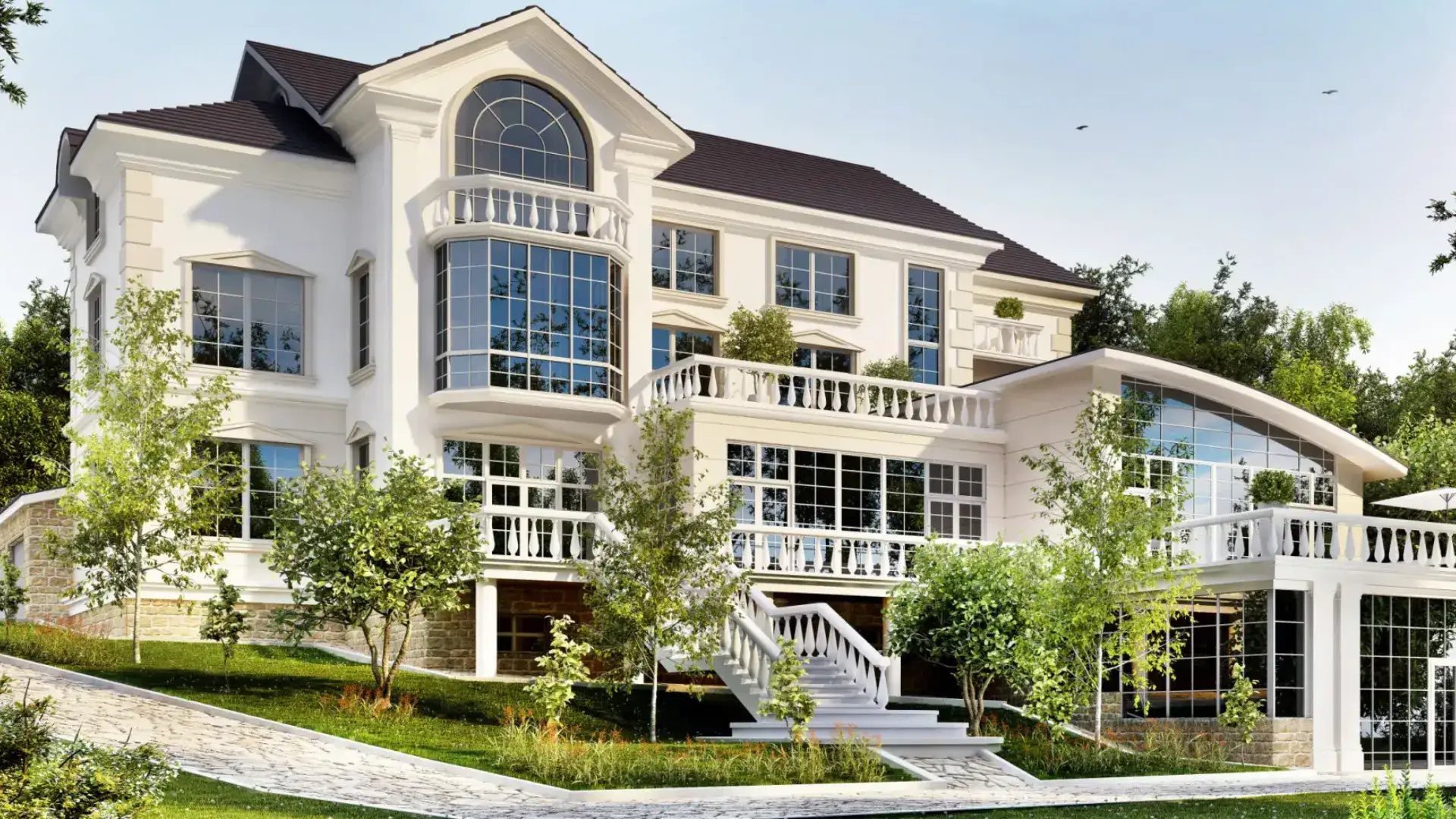 A large modern white house with multiple balconies and large windows.