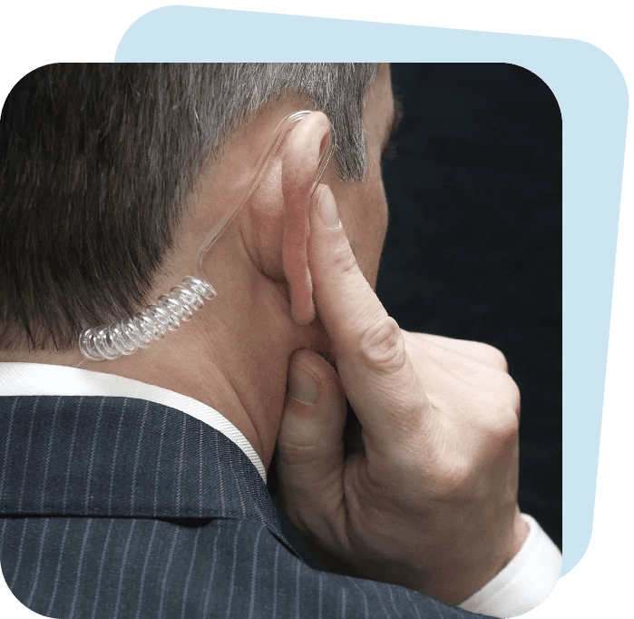 Man using a covert earpiece for communication.