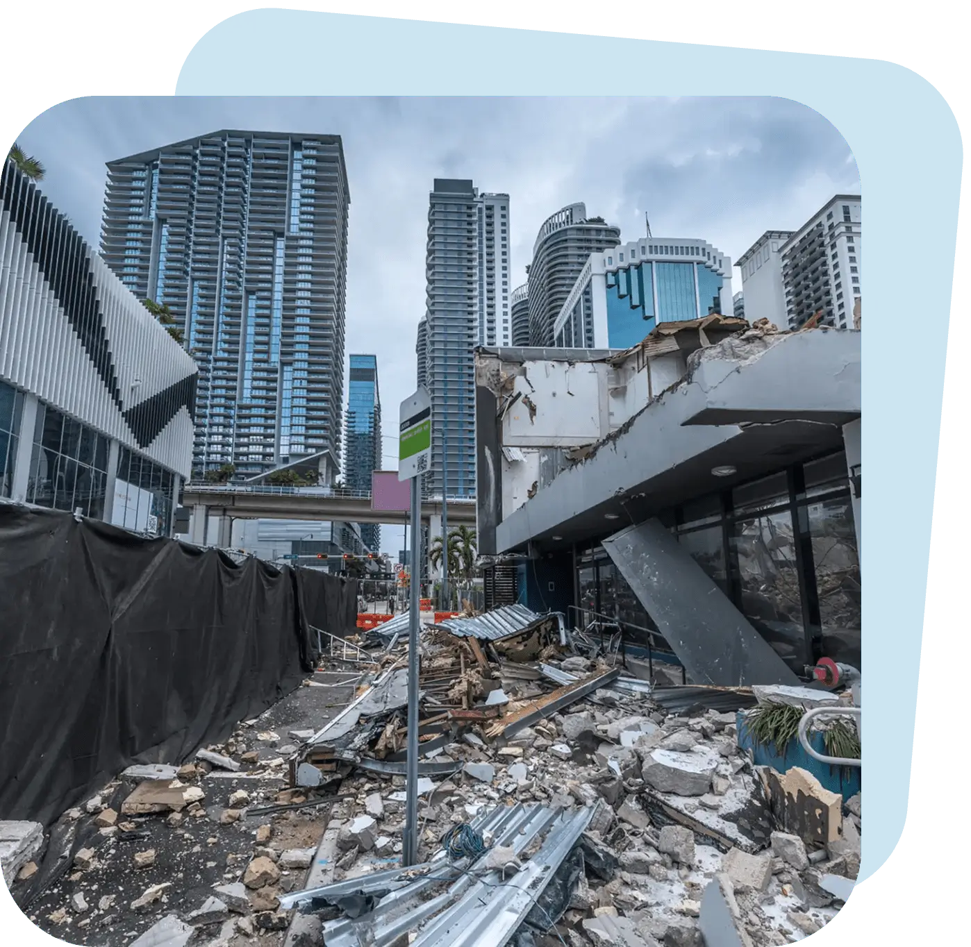 Urban area devastated by a disaster with collapsed buildings and debris.